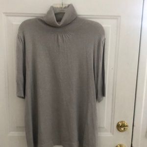 Short sleeve rayon, polyester, metallic and spandex blend turtleneck